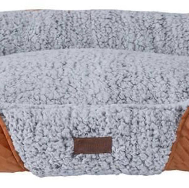 A beige, brown, and gray Quapas self-warming dog bed with a plush design and a visible brand label.